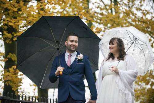 Photograph of Toby & Elizabeth Whittington celebrating their wedding in Norwich